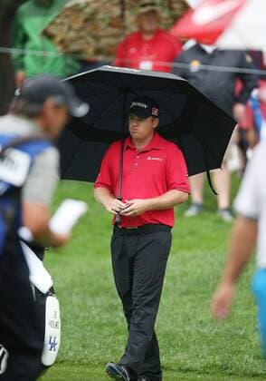 August 8, 2014: J. B. Holmes takes cover from the rain during the second round of the PGA Golf Herren Championship at Valhalla Golf Club in Louisville, Ky. GOLF: AUG 08 PGA Golf Herren - PGA Golf Herren Championship - Second Round Icon20143460 EDITORIAL USE ONLY