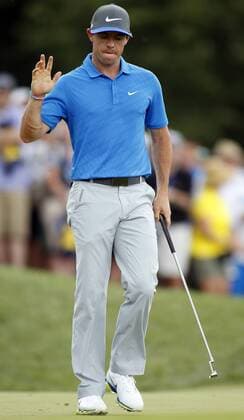 Rory McIlroy, of Norther Ireland, waves to the crowd after sinking a birdie putt on the fifth hole during the third round of the 96th PGA Golf Herren Championship at Valhalla Country Club on .August 9, 2014 in Louisville, Kentucky.  LOU2014080904