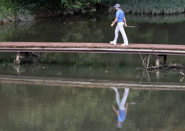 Rory McIlroy, of Northern Ireland, walks toward the sixth fairway after hitting his second shot during the third round of the 96th PGA Golf Herren Championship at Valhalla Country Club on .August 9, 2014 in Louisville, Kentucky. McIlroy shot a four under par 67 and has a one stroke lead over Austria s Bernd Wiesberger heading into Sunday s final round.  LOU2014080907