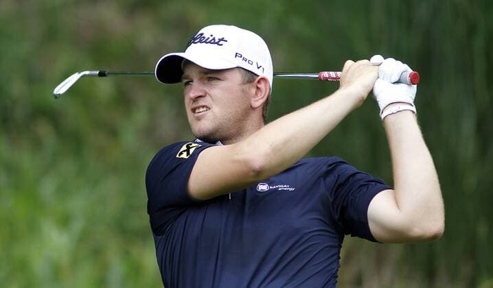 Bernd Wiesberger, of Austria, hits his tee shot on the fifth hole during the third round of the 96th PGA Golf Herren Championship at Valhalla Country Club on .August 9, 2014 in Louisville, Kentucky. Wiesberger shot a six-under 65 and trails leader Rory McIlory by one stroke entering Sunday s final round.  LOU2014080910