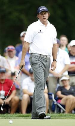 Phil Mickelson, of the United States, reacts to a missed birdie on the first green during the third round of the 96th PGA Golf Herren Championship at Valhalla Country Club on .August 9, 2014 in Louisville, Kentucky. Mickelson shot a four under par 67 and trails leader Rory McIlroy by three strokes entering Sunday s final round.  LOU2014080996