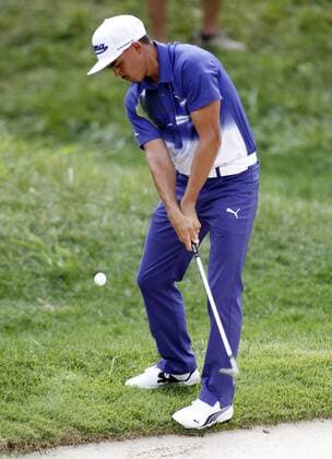 Ricky Fowler, of the United States, chips onto the fourth green during the third round of the 96th PGA Golf Herren Championship at Valhalla Country Club on .August 9, 2014 in Louisville, Kentucky. Day shot four under par 67 and trails leader Rory McIlroy by two strokes entering Sunday s final round.  LOU2014080999