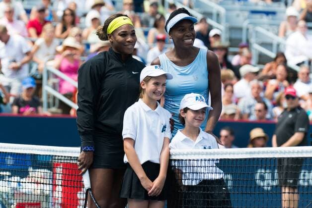 Aug 9, 2014 - Montreal, Quebec, Canada - SERENA WILLIAMS of the USA and VENUS WILLIAMS of the USA during the women s semifinals match of the Rogers Cup at Uniprix Stadium in Montreal. WTA Tennis Damen 2014 - Rogers Cup In Montreal - ZUMAk12
