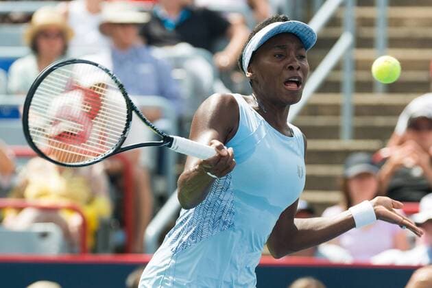 Aug 9, 2014 - Montreal, Quebec, Canada - VENUS WILLIAMS of the USA returns the ball to S. Williams of the USA during their women s semifinals match of the Rogers Cup at Uniprix Stadium in Montreal. WTA Tennis Damen 2014 - Rogers Cup In Montreal - ZUMAk12