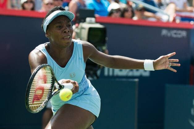 Aug 9, 2014 - Montreal, Quebec, Canada - VENUS WILLIAMS of the USA returns the ball to S. Williams of the USA during their women s semifinals match of the Rogers Cup at Uniprix Stadium in Montreal. WTA Tennis Damen 2014 - Rogers Cup In Montreal - ZUMAk12