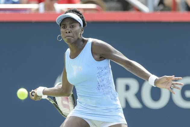 10 August 2014: Venus Williams of the United States hits a return Presented by National Bank at Uniprix Stadium in Montreal, Quebec, Canada. Rogers Cup champion. TENNIS: AUG 10 Rogers Cup - Montreal Icon11258 EDITORIAL USE ONLY