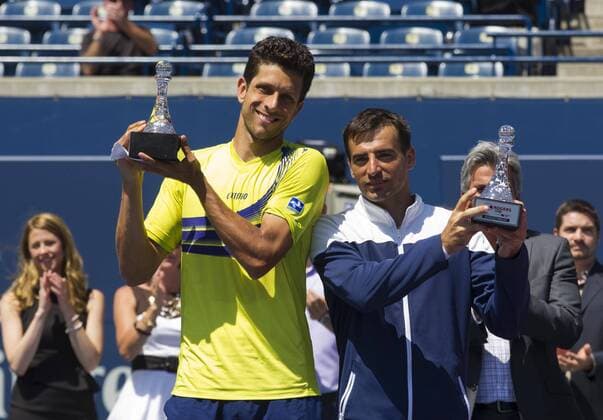 (140811) -- TORONTO, Aug. 10, 2014 -- Ivan Dodig(R) of Croatia and Marcelo Melo of Brazil pose for photos with their runner-up trophies after the final of men s doubles Rogers Cup 