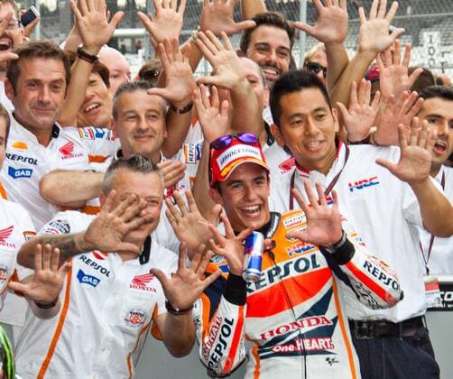 Marc Marquez and crew celebrate winning the 7th running of the Red Bull Moto GP at the Indianapolis Motor Speedway on August 10, 2014 in Indianapolis, Indiana. The 10 fingers signify his 10th consecutive win this Moto GP season.  IND20140801007