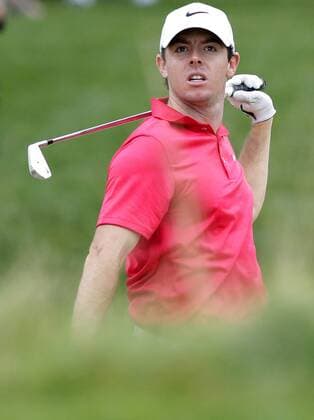 Rory McIlroy watches his ball after hitting out of a fairway bunker on hole 13 in the first round at The Barclays at Ridgewood Country Club in Paramus, NJ on August 21, 2014. The Barclays this year returns to the Championship Course at the historic Ridgewood Country Club, site of The Barclays 2008 and 2010 championship.  NYP20140821112