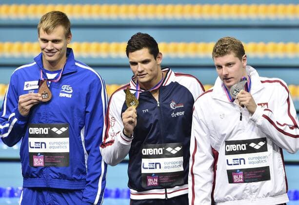 SWIMMING - LEN European championships BERLIN,GERMANY,24.AUG.14 - SWIMMING - LEN European championships. 50m Freestyle, men award ceremony. Image shows Konrad Cerniak (POL), Florent Manaudou (FRA) and Ari-Pekka Liukkonen (FIN). Keywords: medal. 