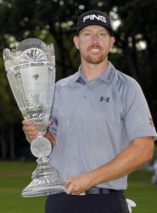 Hunter Mahan holds the championship trophy after the final round at The Barclays at Ridgewood Country Club in Paramus, NJ on August 24, 2014. The Barclays this year returns to the Championship Course at the historic Ridgewood Country Club, site of The Barclays 2008 and 2010 championship. Hunter Mahan wins the tournament with a score of 14 under par.  NYP20140824125