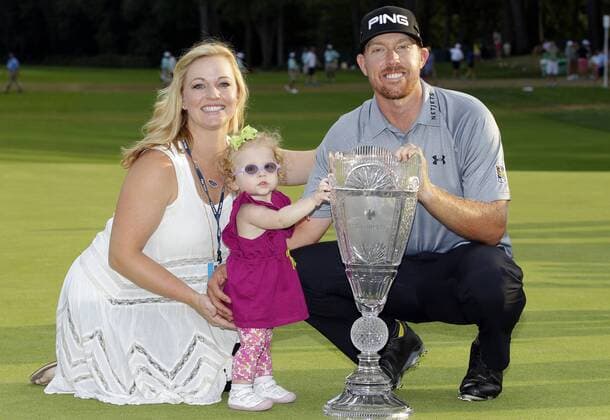 Hunter Mahan holds the championship trophy with his wife Kandi and daughter Zoe after the final round at The Barclays at Ridgewood Country Club in Paramus, NJ on August 24, 2014.  NYP20140824126