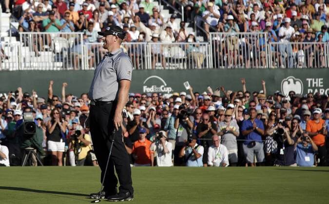 Hunter Mahan reacts after making a putt on the 18th hole in the final round at The Barclays at Ridgewood Country Club in Paramus, NJ on August 24, 2014. The Barclays this year returns to the Championship Course at the historic Ridgewood Country Club, site of The Barclays 2008 and 2010 championship. Hunter Mahan wins the tournament with a score of 14 under par.  NYP20140824135