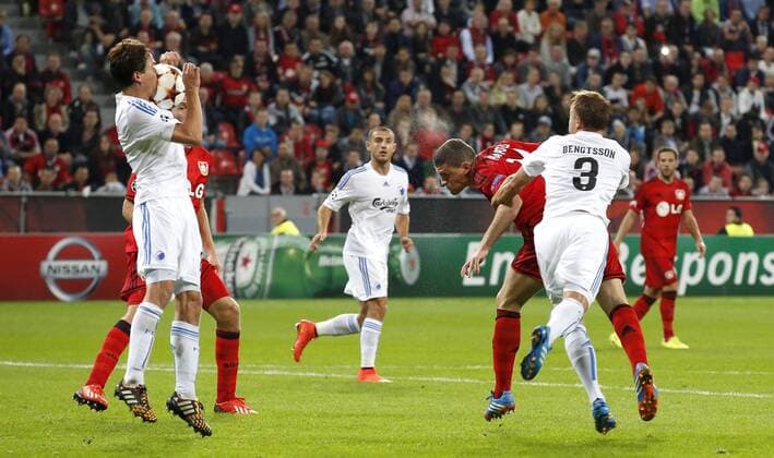 Leverkusens Kyriakos Papadopoulos (R) heads against a player during the Championsleague Play-off match between Bayer 04 Leverkusen and FC Kopenhagen, Bayarena in Leverkusen on August 27., 2013. Bayer 04 Leverkusen vs. FC Kopenhagen in der Champions League Qualifikation der Saison 2014 2015 am 27. August 2014.