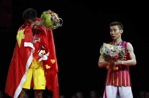 COPENHAGEN -- Lee Chong Wei of Malaysia looks at Chen Long of China during the awarding ceremony for the Men s Singles Final on Day 7 of Li Ning BWF World Championships 2014 at Ballerup Super Arena in Copenhagen, Denmark on Aug. 31, 2014. 