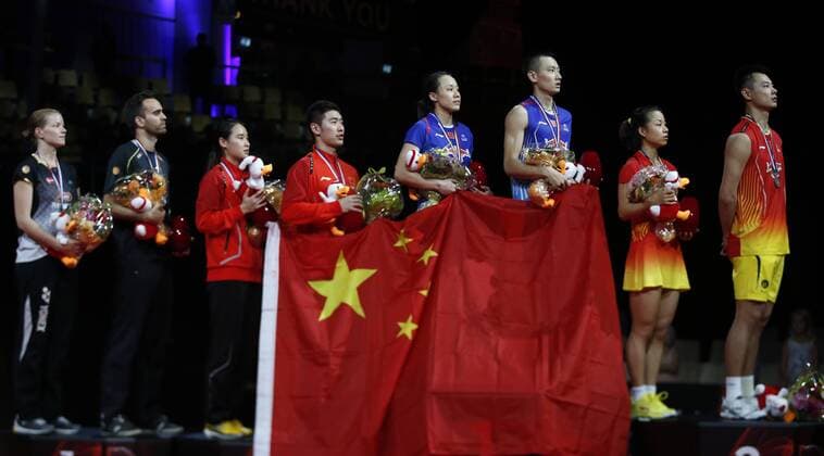 COPENHAGEN -- (From L to R) Christinna Pedersen and Joachim Fischer Nielsen of Denmark, Bao Yixin, Liu Cheng, Zhao Yunlei, Zhang Nan, Ma Jin and Xu Chen of China pose during the awarding ceremony for the Mixed Doubles Final on Day 7 of Li Ning BWF World Championships 2014 at Ballerup Super Arena in Copenhagen, Denmark on Aug. 31, 2014. 