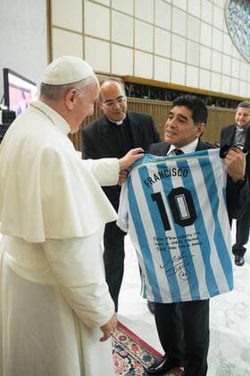 September 1, 2014: Diego Armando Maradona presents Pope Francis with an Argentine national soccer team jersey bearing the name Francisco, in the Paul VI hall at the Vatican. 