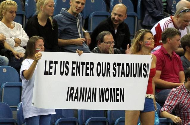 02.09.2014 Krakow(Poland) FIVB Men s Volleyball World Championship Iran preliminary round Women s activists with transparent of support Iranian women s on the stadiums : 