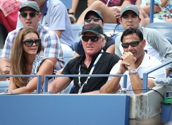 US Open 2014, USTA Billie Jean King National Tennis Center, Flushing Meadows, New York, ITF Grand Slam Tennis Tournament, Grigor Dimitrov (BUL) Team in der Spieler Loge, R-L. Trainer Roger Rashid neben ihm sitzt Golf Legende Greg Norman mit seiner Frau Kirsten Kutner, Halbkörper, Querformat,