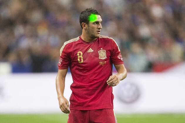 Koke of Spain has a laser pen aimed at his face - France vs. Spain - International Friendly - Stade de France - Paris - 04 09 2014 EDITORIAL USE ONLY. No use with unauthorised audio, video, data, fixture lists, club league logos or live services. Online in-match use limited to 120 images, no video emulation. No use in betting, games or single club league player publications.