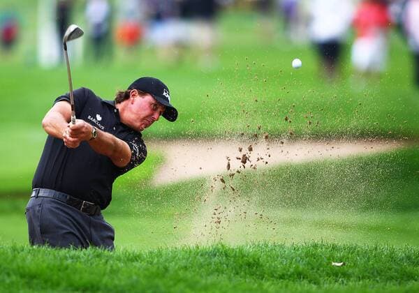 September 05 2014: Phil Mickelson hits from the sand trap on the first hole during the second round of the BMW Championship PGA Golf Herren Tour at Cherry Hills Country Club in Englewood, CO. GOLF: SEP 05 PGA Golf Herren - BMW Championship - Second Round Icon140905001 EDITORIAL USE ONLY