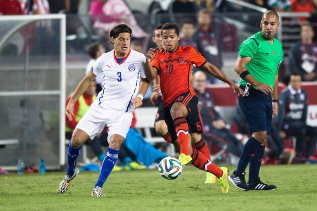September 06, 2014: Mexico midfielder Giovani Dos Santos (10) and Chile defender Miiko Albornoz (3) battle for possession, during the game between Mexico and Chile at Levi s Stadium in Santa Clara. The game ended in a 0-0 draw. SOCCER: SEP 06 Mexico v Chile Icon20140906043 EDITORIAL USE ONLY