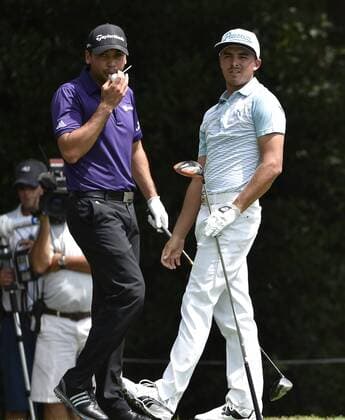 Rickie Fowler (R) and Jason Day drive No. 3 during the first round of the PGA Golf Herren Tour Championship on September 11, 2014 at East Lake Golf Club in Atlanta. The sport s top players are competing for a chance to win the FedExCup and a $10 million bonus.  AJP2014091113
