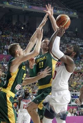 USA s Kyrie Irving (r) and Lithuania s Renaldas Seibutis (l) and Donatas Motiejunas during 2014 FIBA Basketball World Cup Semi-final match.September 11,2014.  (19089732)