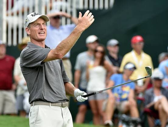 Jim Furyk gestures at his tee stroke on No. 18 before finishing the day with a 7-under total score, three strokes behind Billy Horschel and Rory McIlroy, who are tied for the lead during the third round of the PGA Golf Herren Tour Championship at East Lake Golf Club on September 13, 2014, in Atlanta.  AJP2014091326