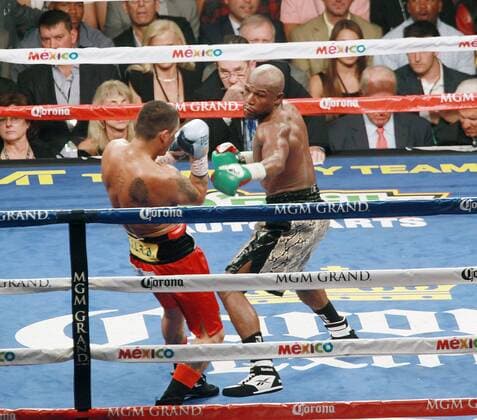 Sept. 13, 2014 - Las Vegas, Nevada, United States - Boxing Champion Floyd Mayweather punches challenger Marcos Maidana during MAYHEM: Mayweather vs Maidana 2 on September 13, 2014 at MGM Grand Arena in Las Vegas, Nevada MAYHEM: Mayweather vs Maidana 2 - ZUMAt114