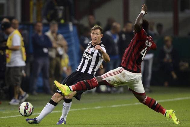 Stephan Lichtsteiner Juventus, Sulley Muntari Milan Milano 20-09-2014 Stadio Giuseppe Meazza - Serie A - AC Milan - Juventus Turin -- giuseppexceleste