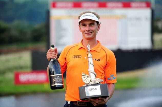 21.09.2014. Newport, Wales. ISPS Handa Wales Open Golf. Day 4. Joost Luiten claims his prize with trophy and champagne xJonxBromleyx  ActionPlus11562526