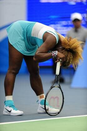 Serena Williams of the United States reacts during the Women s singles match at the WTA Tennis Damen Wuhan Open tennis tournament in Wuhan capital of central China s Hubei Province, on Sept. 23, 2014. ) (djj) (SP)CHINA-WUHAN-TENNIS-WUHAN OPEN-WILLIAMS HaoxTongqian 