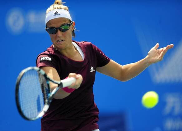 Kirsten Flipkens of Belgium hits a return during the women s singles 3rd round match at the WTA Tennis Damen Wuhan Open tennis tournament in Wuhan, capital of central China s Hubei Province, on Sept. 24, 2014. (SP)CHINA-WUHAN-TENNIS-WTA-WUHAN OPEN HaoxTongqian 