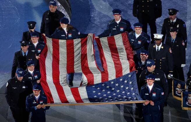 Feb. 8, 2002 - U.S. - KRT SPORTS STORY SLUGGED: OLY-CEREMONY KRT PHOTOGRAPH BY MARK REIS COLORADO SPRINGS GAZETTE (February 9) The flag from the World Trade Center Towers is carried into the stadium at the Winter Olympic Opening Ceremony Friday February 8, 2002 in Salt Lake City, Utah. (GT) BL NC KD 2002 (Horiz) (lde) News Archive - Feb. 8, 2002 - ZUMAm67_
