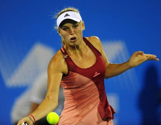 (140924) -- WUHAN, Sept. 24, 2014 -- Denmark s Caroline Wozniacki returns a shot during the women s singles 3rd round match WTA Tennis Damen Wuhan Open tennis tournament in Wuhan, capital of central China s Hubei Province, on Sept. 24, 2014. HaoxTongqian 