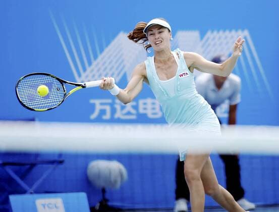 Martina Hingis of Switzerland returns a shot during the women s doubles semifinals of the 2014 WTA Tennis Damen Wuhan Open tennis tournament in Wuhan city, central China s Hubei province, 26 September 2014.  20140926_63204