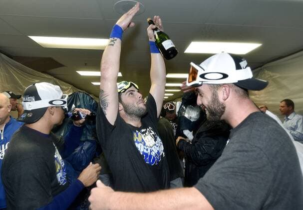 Sept. 26, 2014 - Chicago, IL, USA - The Kansas City Royals Mike Moustakas and Danny Duffy celebrate after the team clinches a wild card spot following a 3-1 win against the Chicago White Sox on Friday, Sept. 26, 2014, at U.S. Cellular Field in Chicago. The postseason berth is the Royals first in 29 years. Kansas City at Chicago White Sox - ZUMAm67_