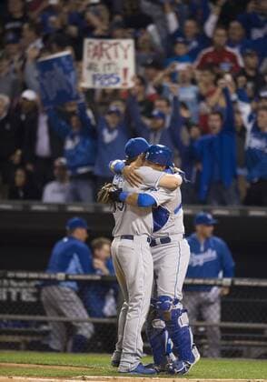 Sept. 26, 2014 - Chicago, IL, USA - Kansas City Royals first baseman Eric Hosmer, left, and catcher Salvador Perez meet at home plate to embrace as the team clinches a wild card spot following a 3-1 win against the Chicago White Sox on Friday, Sept. 26, 2014, at U.S. Cellular Field in Chicago. The postseason berth is the Royals first in 29 years. Kansas City at Chicago White Sox - ZUMAm67_