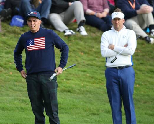 USA s Rickie Fowler (L) in the morning fourball match against Europe s Rory McIlroy ( Mc Ilroy ) and Ian Poulter on the second day of the 2014 Ryder Cup in Gleneagles,Scotland on September 27, 2014.The match was halved.  LON2014092607A