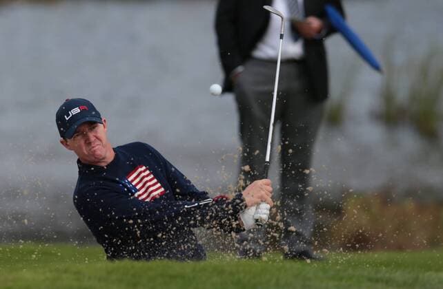 USA s Jimmy Walker plays a bunker shot in the morning fourball match against Europe s Rory McIlroy ( Mc Ilroy ) and Ian Poulter on the second day of the 2014 Ryder Cup in Gleneagles,Scotland on September 27, 2014.The match was halved.  LON2014092730