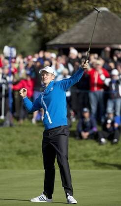 Europe s Justin Rose celebrates a putt over USA s Bubba Watson and Matt Kuchar in the morning fourball match on the second day of the 2014 Ryder Cup in Gleneagles,Scotland on September 27, 2014.The match was won 3 and 2.  LON2014092734