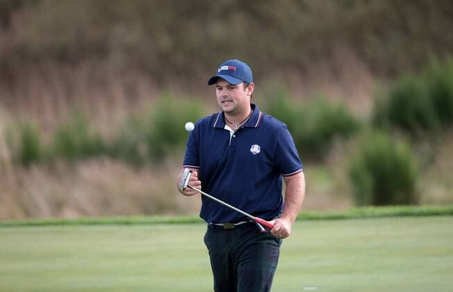 USA s Patrick Reed bounces a ball in the afternoon foursomes match against Europe s Martin Kaymer and Justin Rose on the second day of the 2014 Ryder Cup in Gleneagles,Scotland on September 27, 2014.  LON2014092742