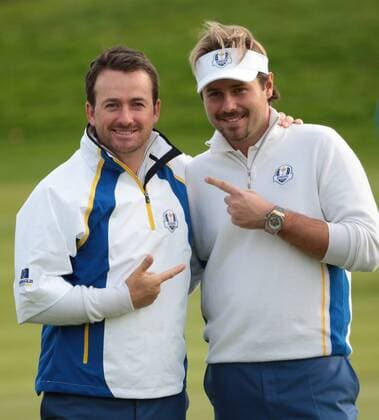 Europe s Graeme McDowell and Victor Dubuisson pose after victory in the afternoon foursomes match against USA s Jimmy Walker and Rickie Fowler on the second day of the 2014 Ryder Cup in Gleneagles,Scotland on September 27, 2014.  LON2014092755