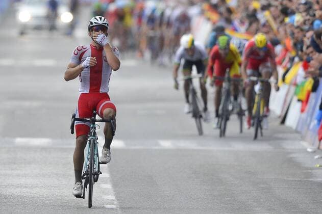 - PONFERRADA, SPAIN: Polish Michal Kwiatkowski of team Omega Pharma - Quick Step leads just before the finnish line during the men s elite road race at the UCI World Cycling championships in Ponferrada, Spain, Sunday 28 September 2014. DIRKxWAEM  premiumd Aufmacher 20227766