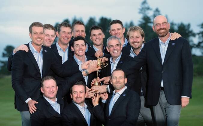 Members of the European team hold the Ryder Cup after defeating the United States by sixteen and a half points to eleven and a half points on the final day of the 2014 Ryder Cup in Gleneagles,Scotland on September 28, 2014.  LON2014092803