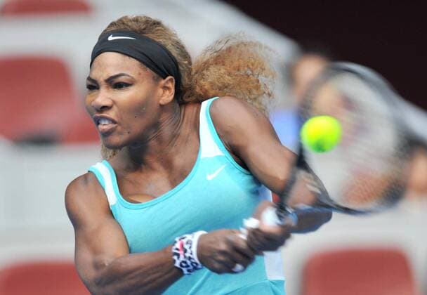 Serena Williams of the United States returns a shot during the women s 1st round match at the 2014 China Open in Beijing, capital of China, on Sept. 29, 2014. (SP)CHINA-BEIJING-TENNIS-CHINA OPEN LixWen 