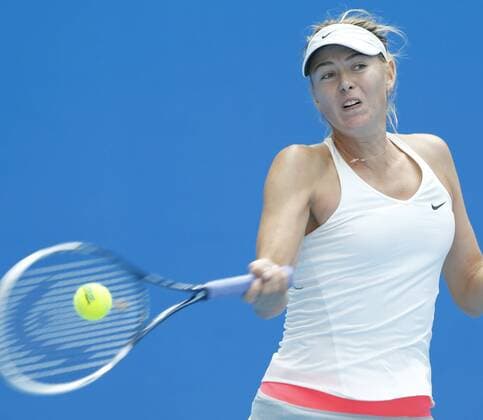 Maria Sharapova of Russia returns a shot during the women s 2nd round match at the 2014 China Open in Beijing, capital of China, on Sept. 30, 2014. ChenxJianli 