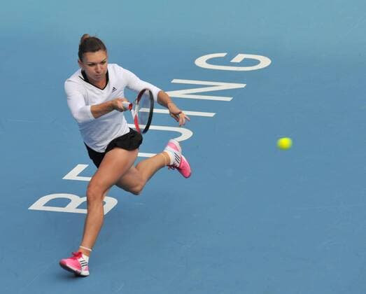 Simona Halep of Romania competes during the women s singles 2nd round match at the 2014 China Open in Beijing, capital of China, on Sept. 30, 2014. LixWen 