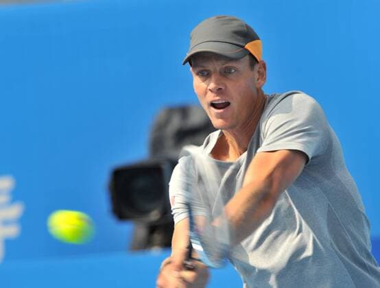 Tomas Berdych of Czech Republic returns a shot during the men s singles 1st round match at the 2014 China Open in Beijing, capital of China, on Sept. 30, 2014. LixWen 
